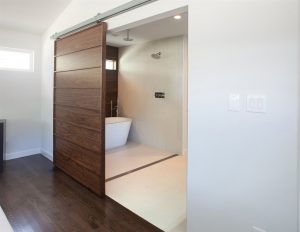 sliding-barn-door-leading-to-bathroom